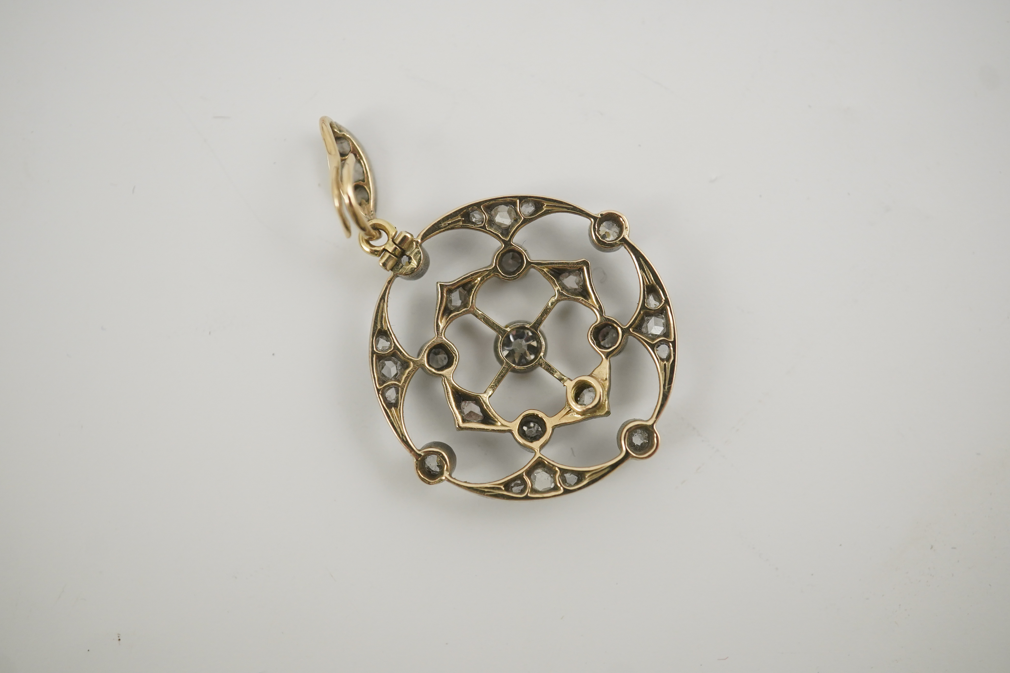 A cased Belle Epoque gold, rose and round cut diamond cluster set open work pendant/brooch